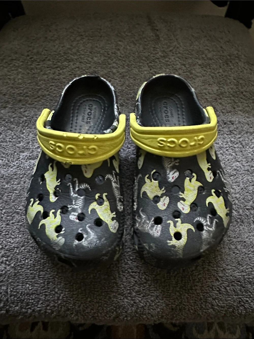 CROCS Kids Black Clogs with Yellow Ghost Print and Yellow Heel Straps